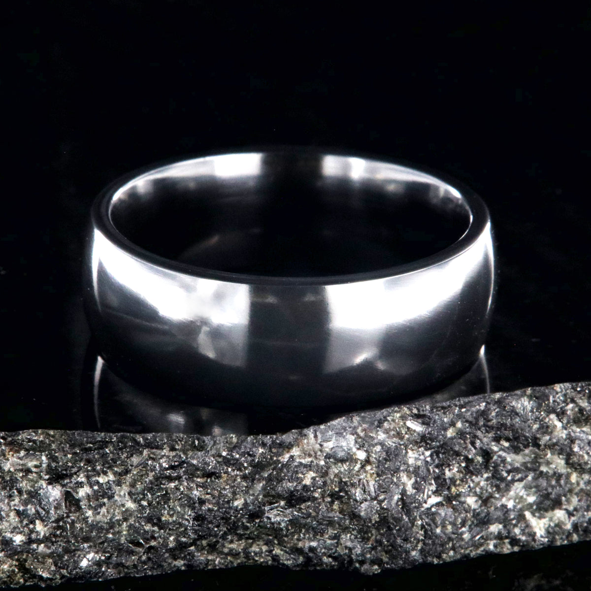 8mm wide black zirconium wedding band with a polished finish and rounded profile