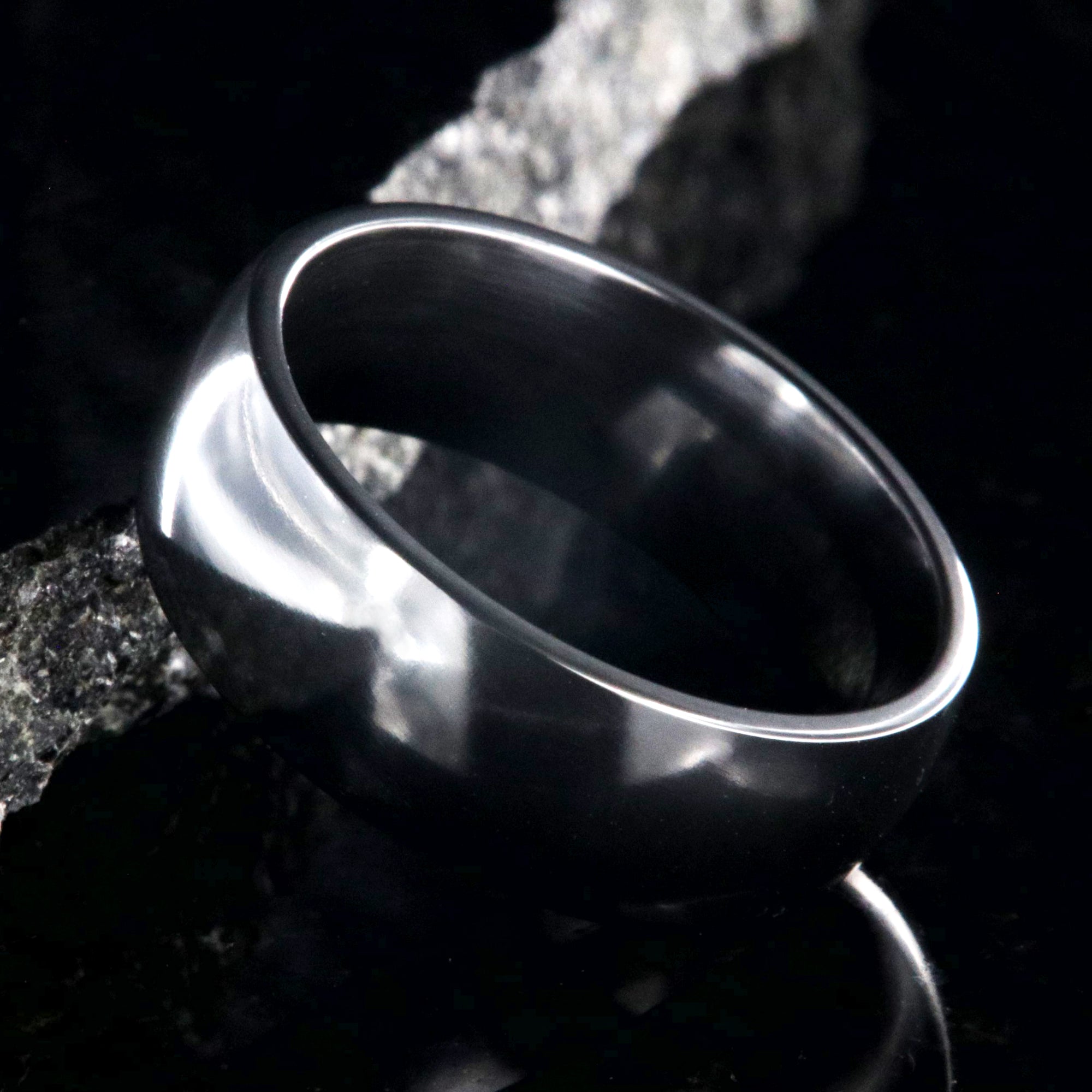 8mm wide black zirconium wedding band with a polished finish and rounded profile