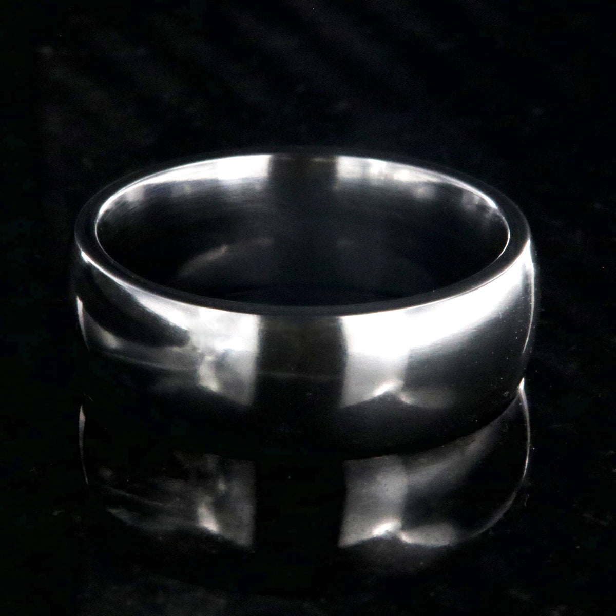 8mm wide black zirconium wedding band with a polished finish and rounded profile