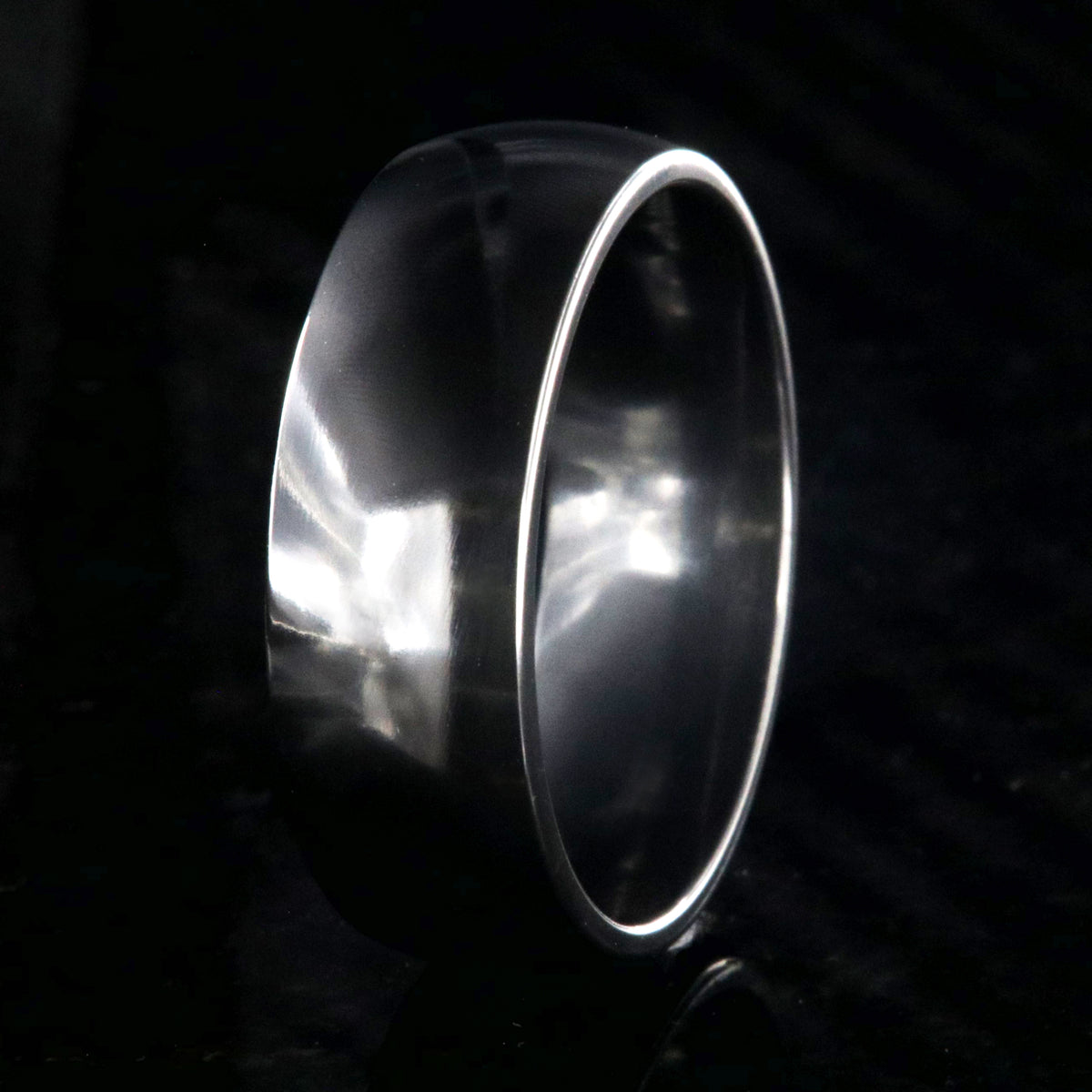 8mm wide black zirconium wedding band with a polished finish and rounded profile