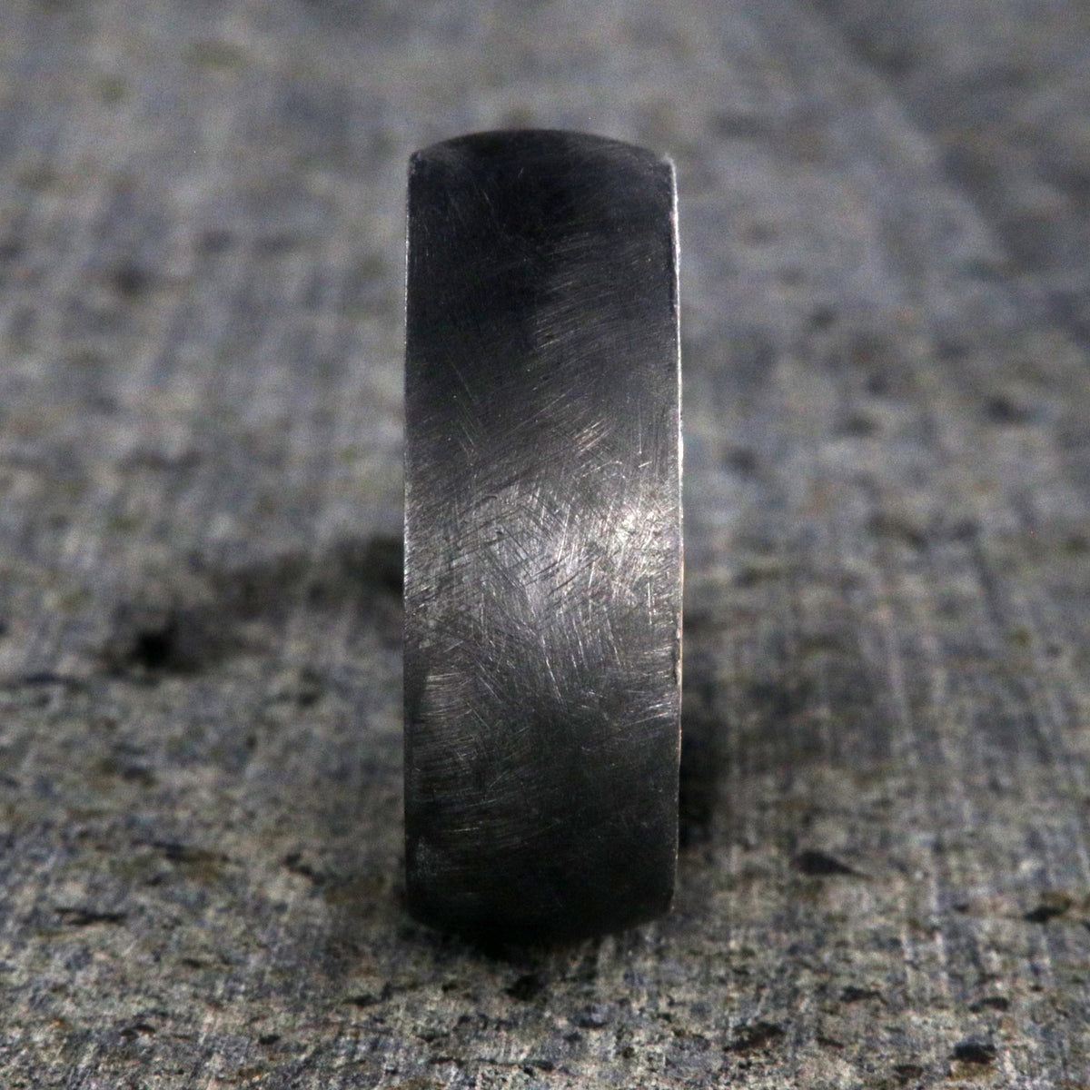 8mm wide black zirconium brushed finish wedding band with a whiskey barrel sleeve