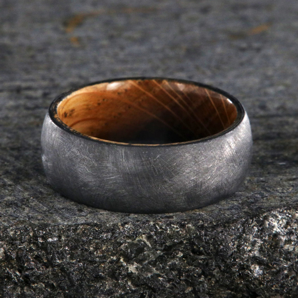 8mm wide black zirconium brushed finish wedding band with a whiskey barrel sleeve