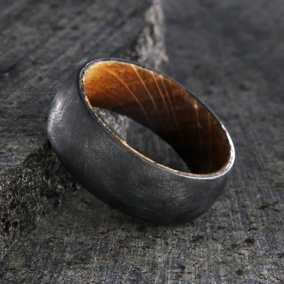 8mm wide black zirconium brushed finish wedding band with a whiskey barrel sleeve
