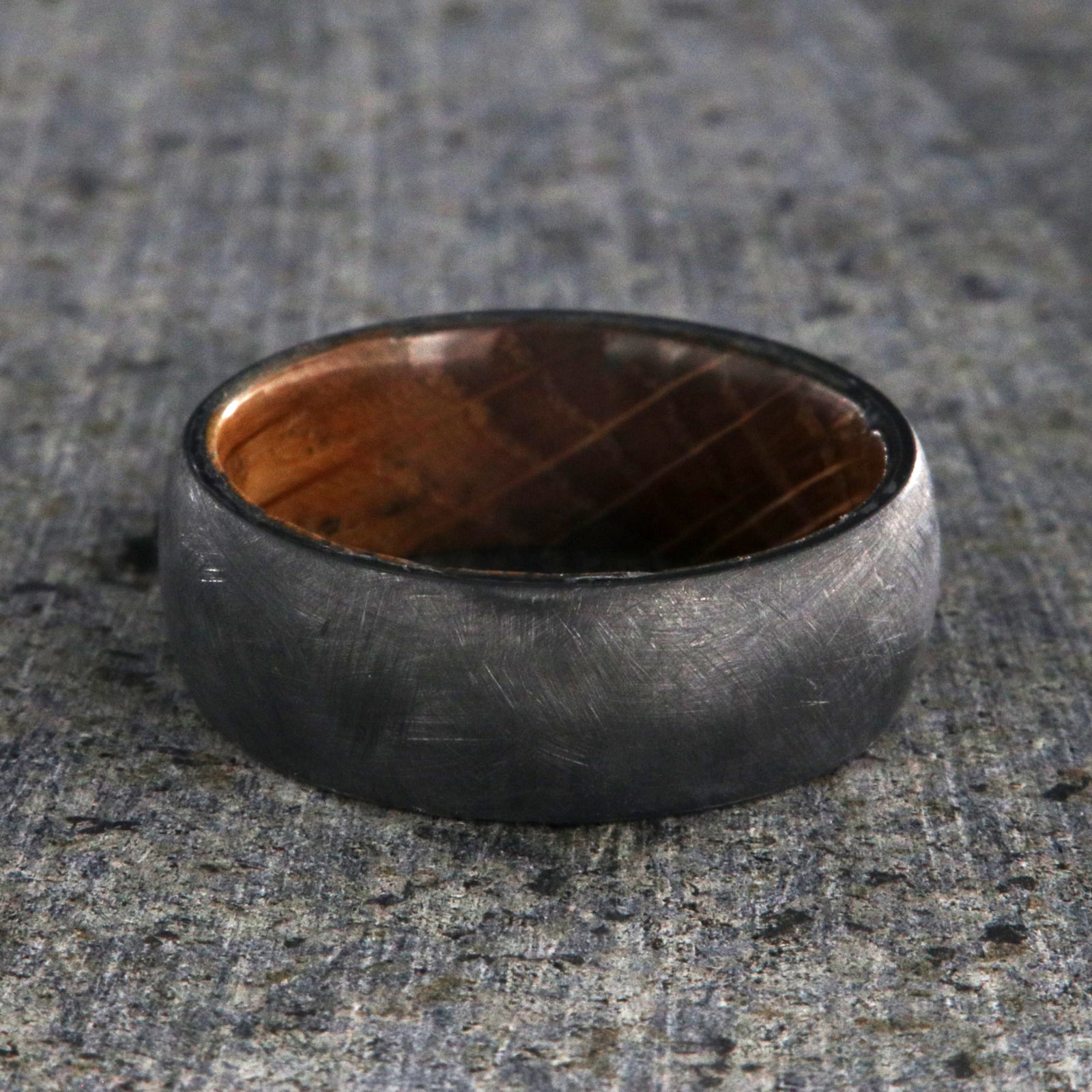 8mm wide black zirconium brushed finish wedding band with a whiskey barrel sleeve