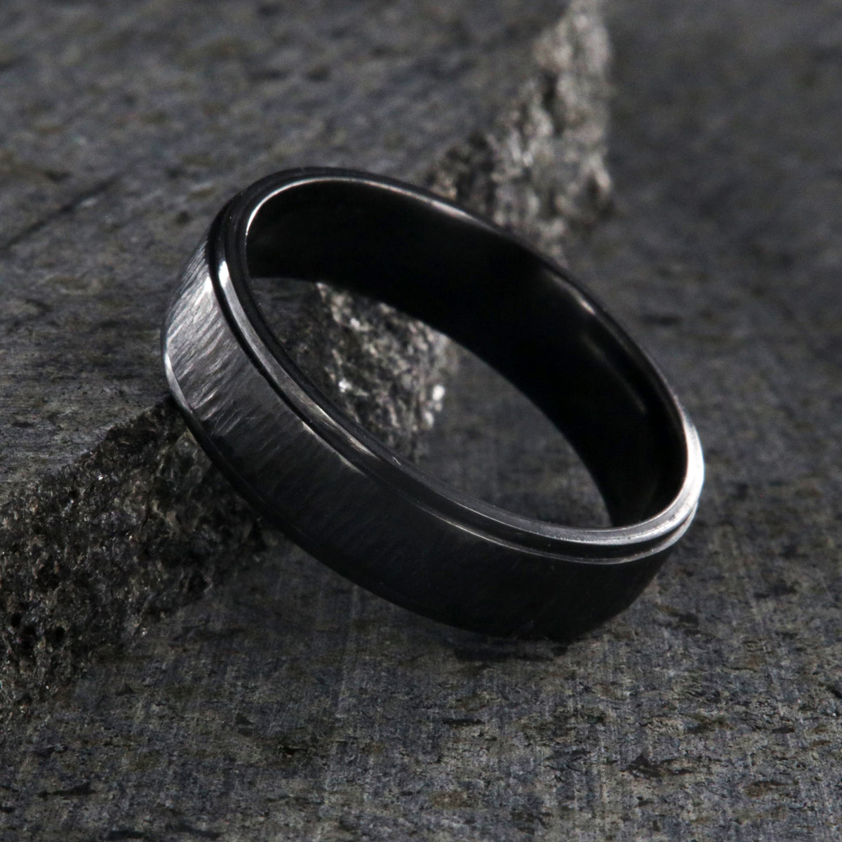 8mm and 6mm wide matching black zirconium wedding ring set with a raised center and tree bark finish