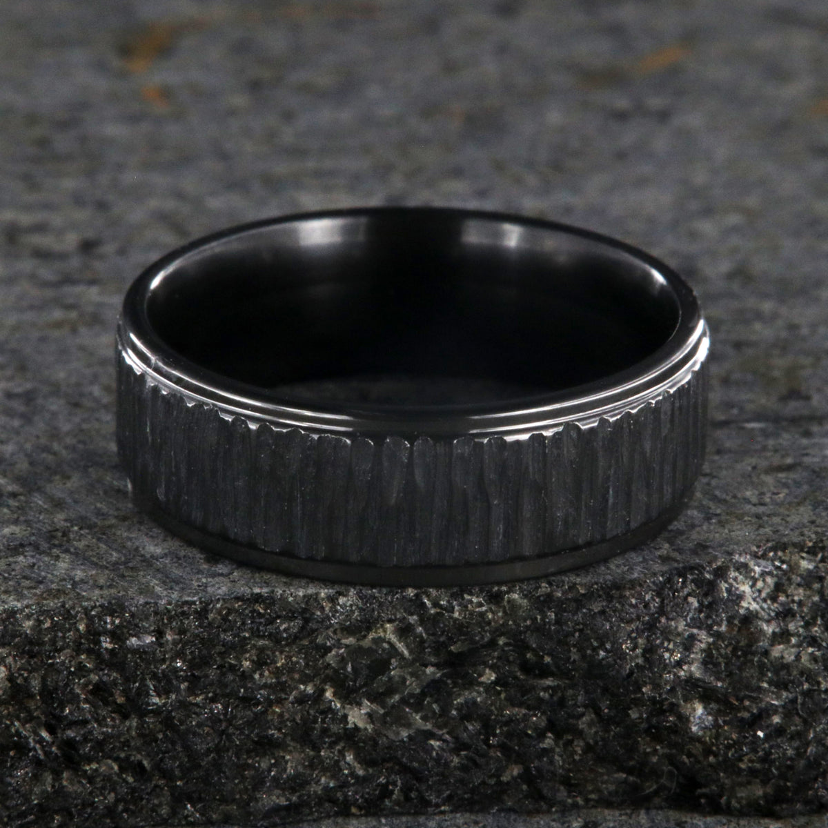 8mm and 6mm wide matching black zirconium wedding ring set with a raised center and tree bark finish