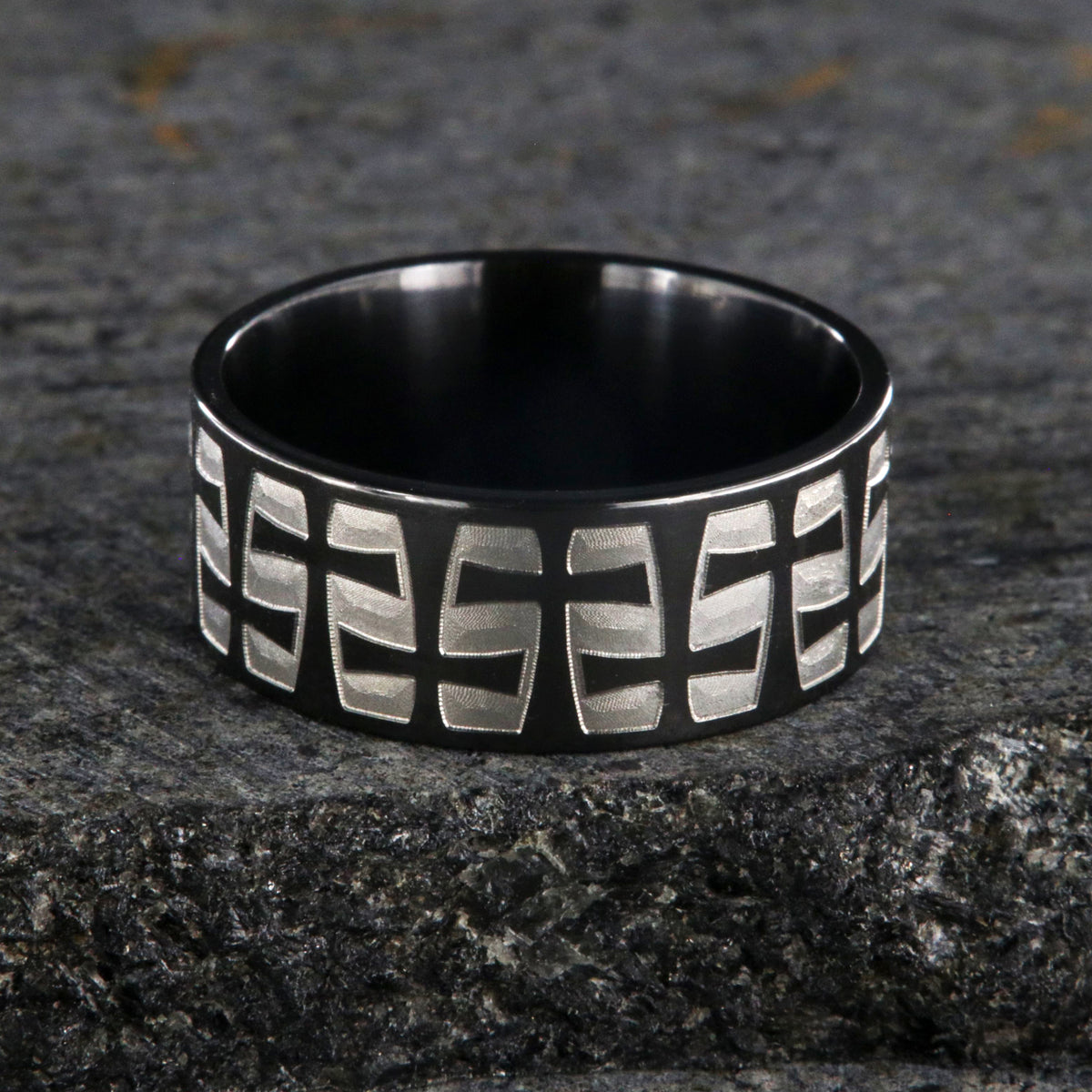 9mm wide black zirconium with a two-tone braided crosses design