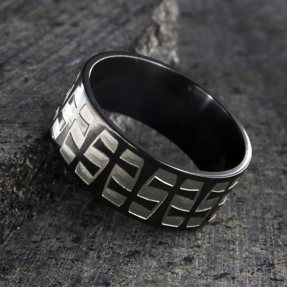 9mm wide black zirconium with a two-tone braided crosses design