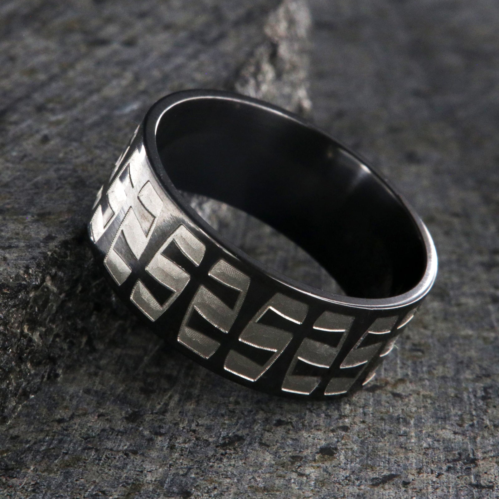 9mm wide black zirconium with a two-tone braided crosses design