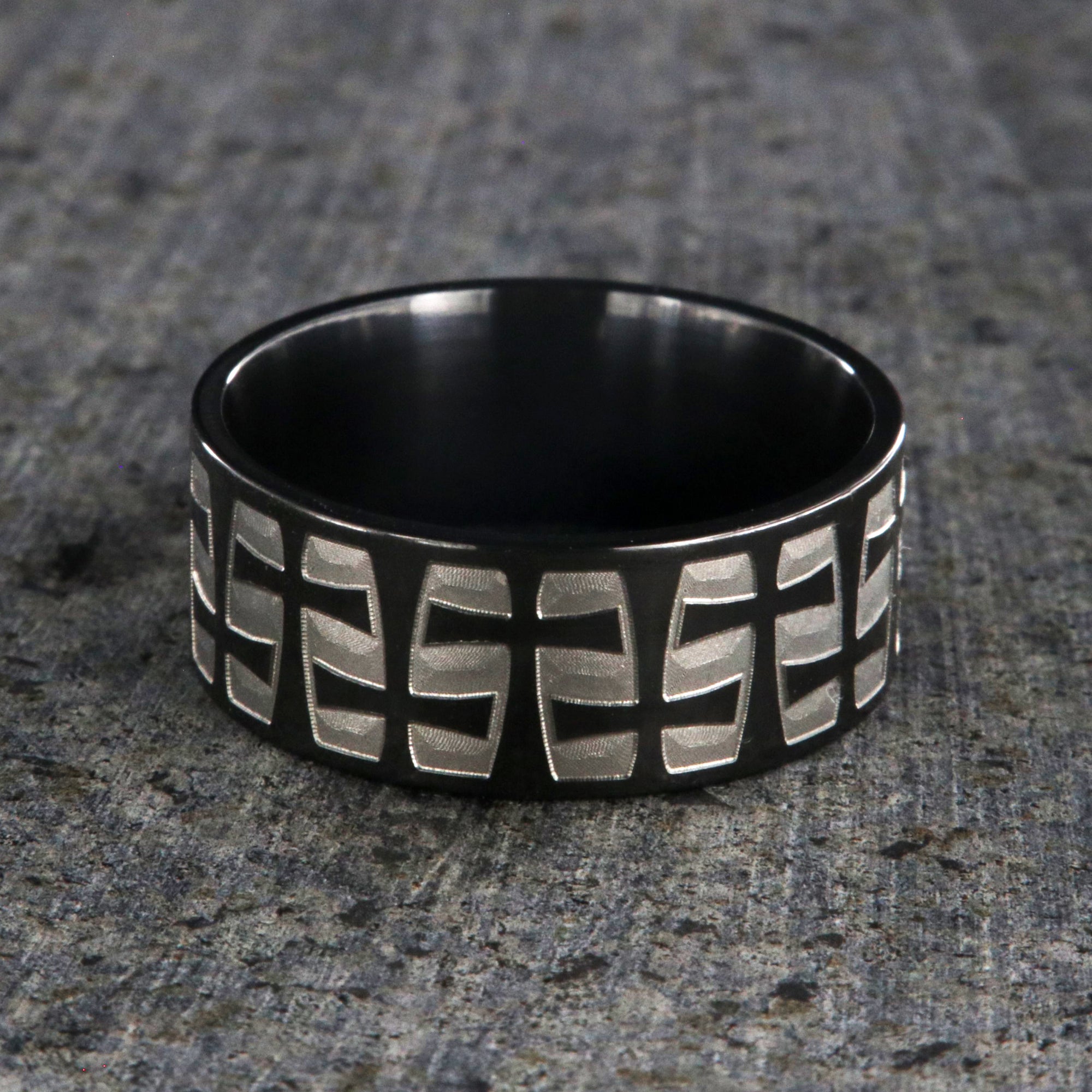 9mm wide black zirconium with a two-tone braided crosses design