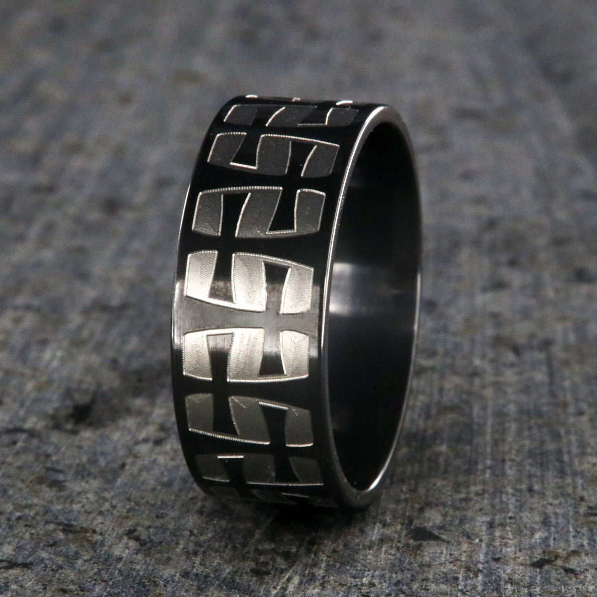 9mm wide black zirconium with a two-tone braided crosses design