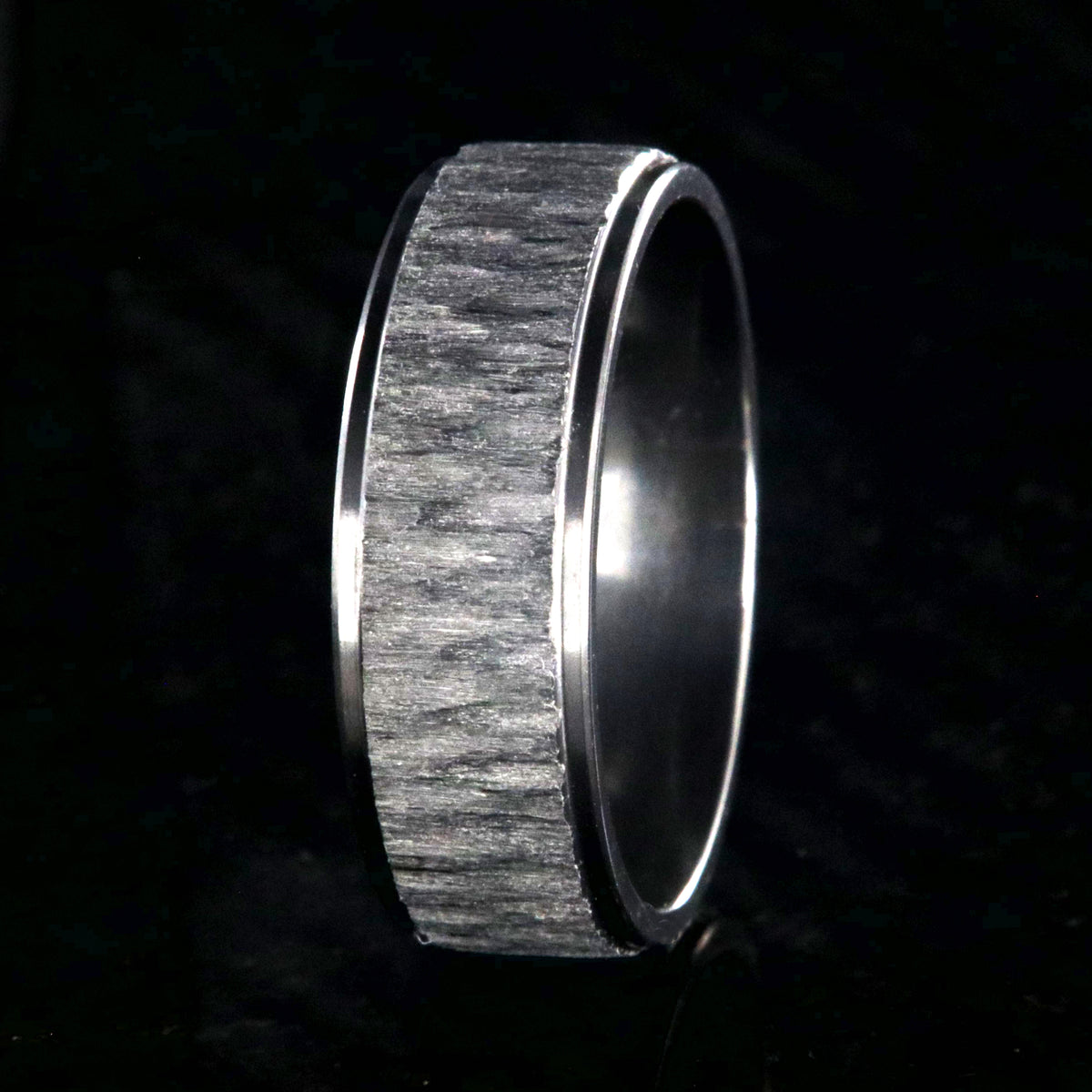 8mm wide black zirconium ring with a raised-center and tree bark finish