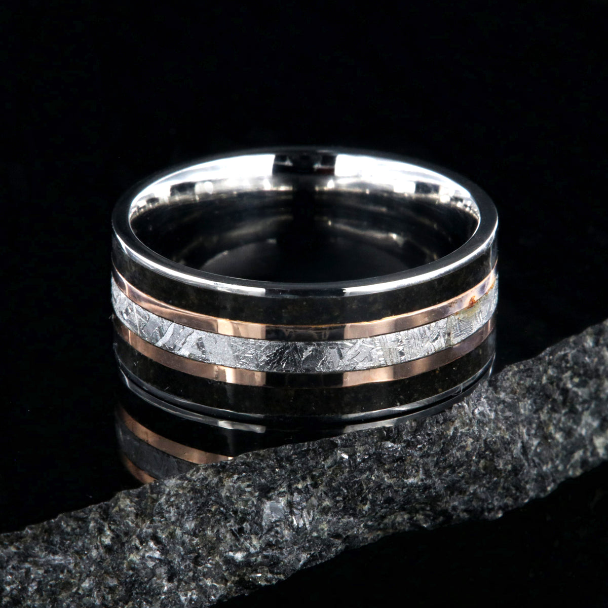 9mm wide ring with meteorite center, dual rose gold inlays, and dinosaur bone edges
