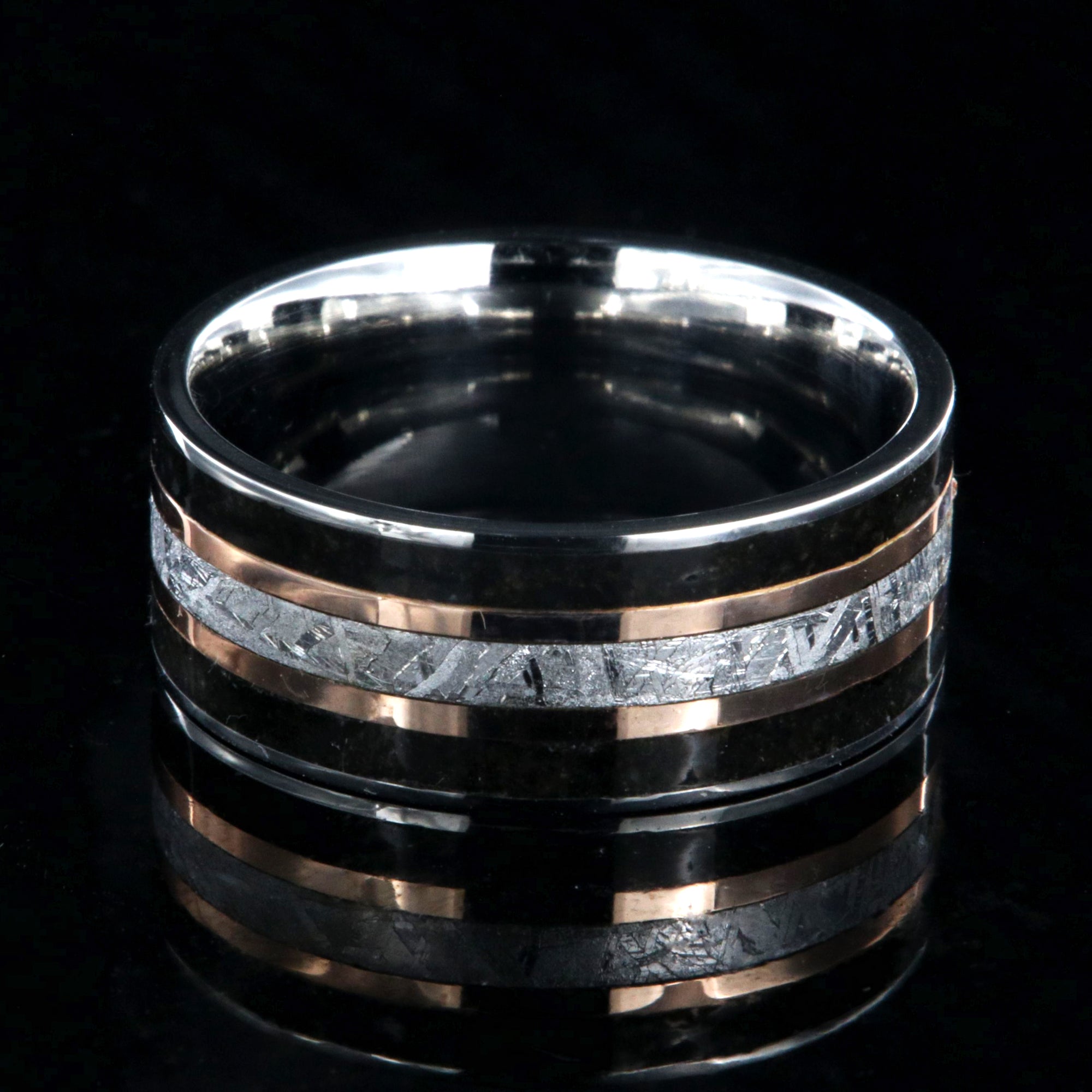 9mm wide ring with meteorite center, dual rose gold inlays, and dinosaur bone edges