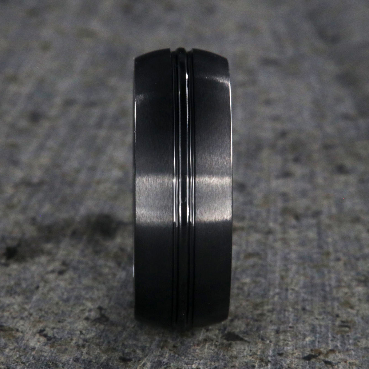 8mm wide black ceramic ring with a center groove and satin finish