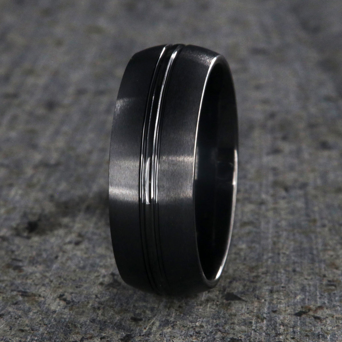 8mm wide black ceramic ring with a center groove and satin finish