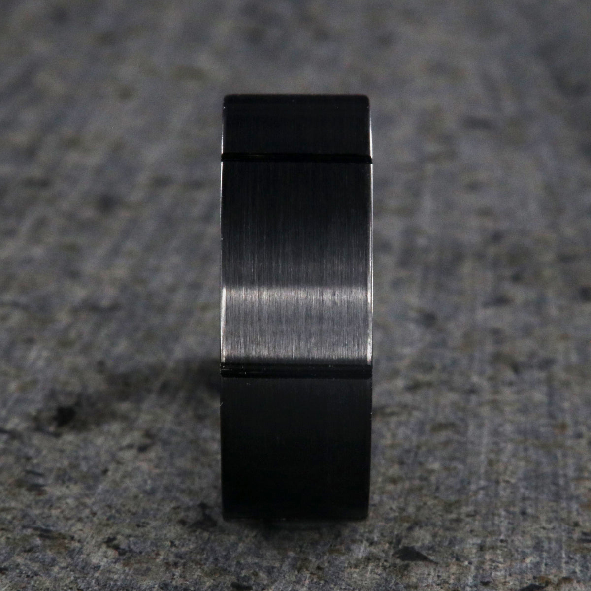 8mm wide black ceramic ring with a matte finish and vertical grooves
