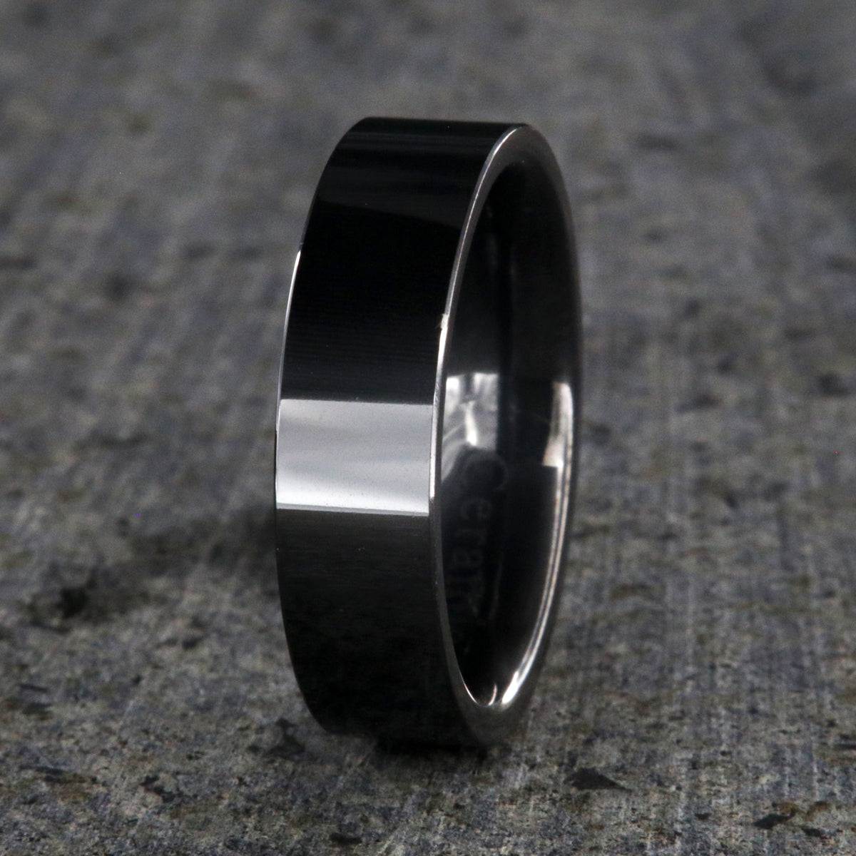 6mm wide black ceramic ring with a flat profile and polish finish