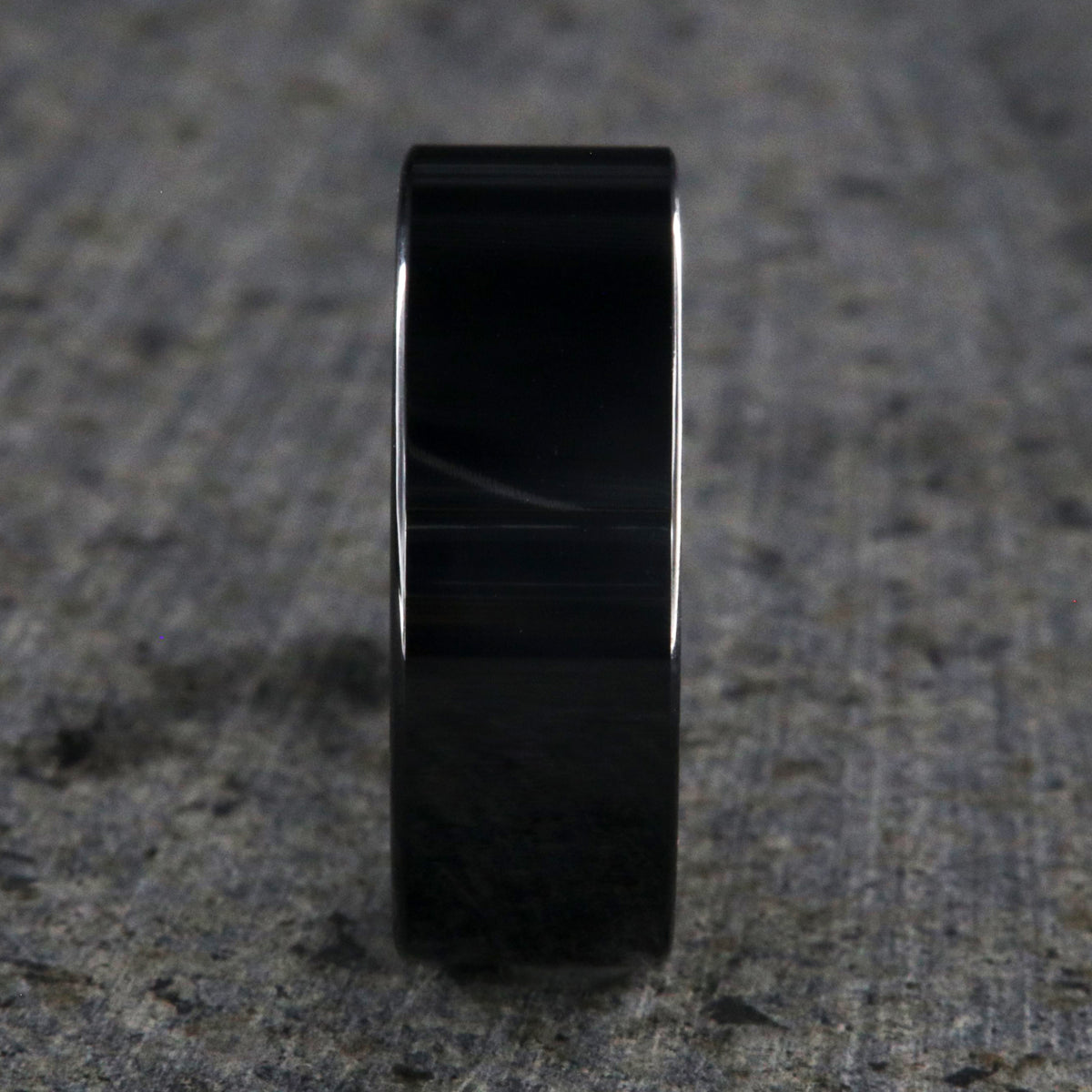 8mm wide black ceramic wedding band with a flat profile and polish finish
