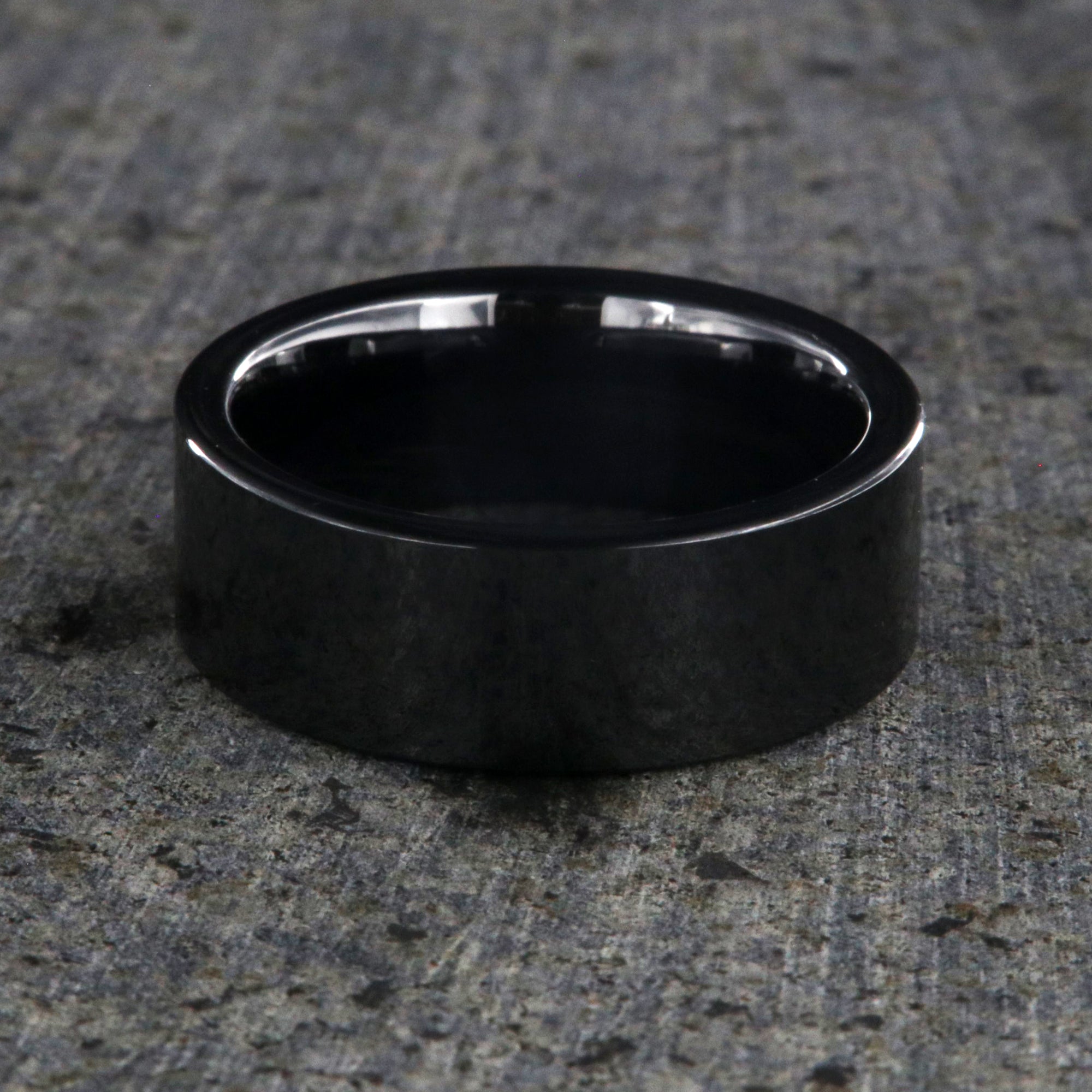 8mm wide black ceramic wedding band with a flat profile and polish finish