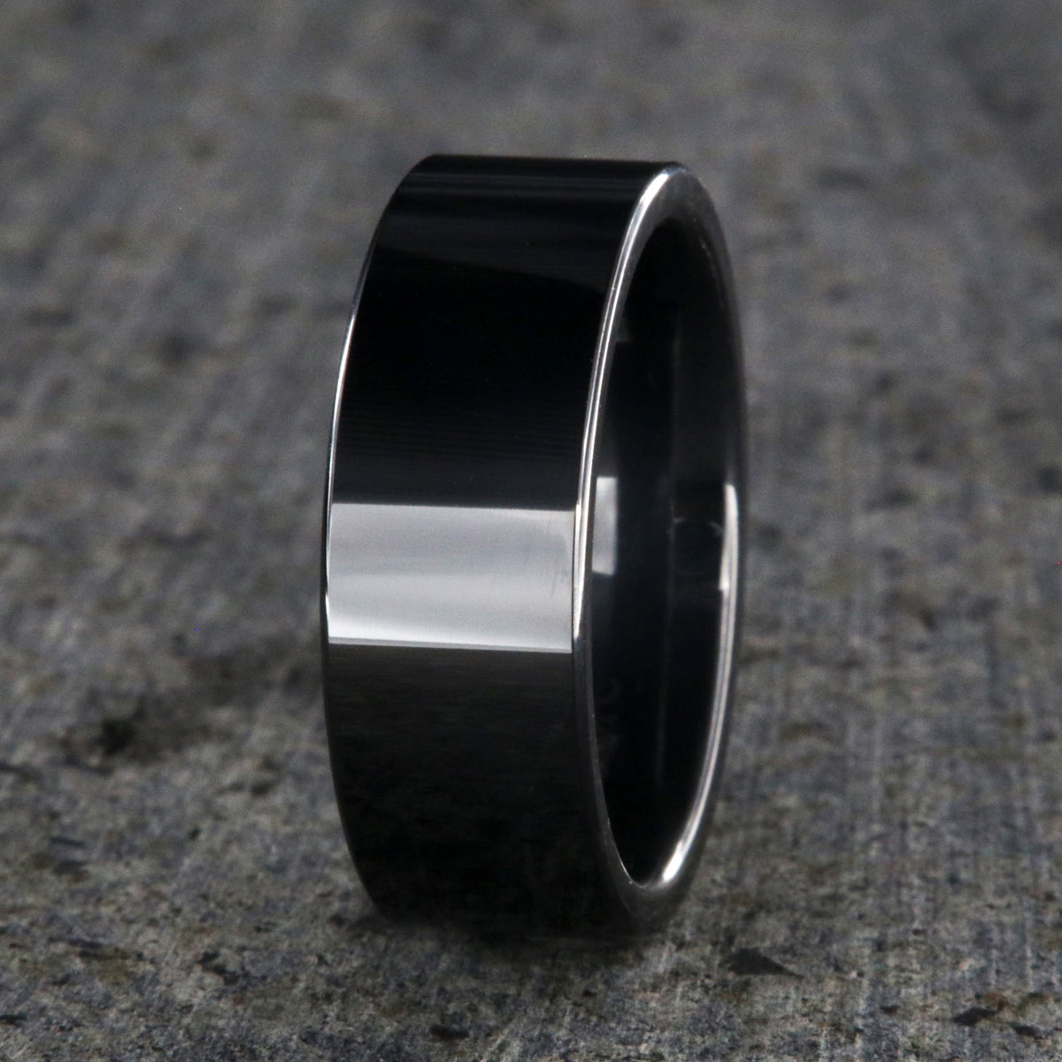 8mm wide black ceramic wedding band with a flat profile and polish finish