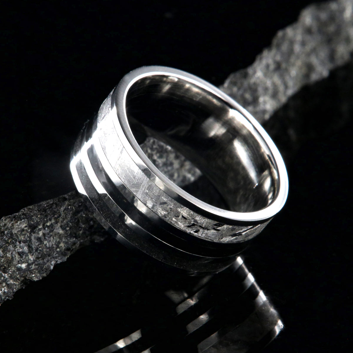 10mm wide meteorite ring with 3mm meteorite inly with 1.5mm dinosaur bone inlay, 1.5mm stardust inlay and cobalt sleeve