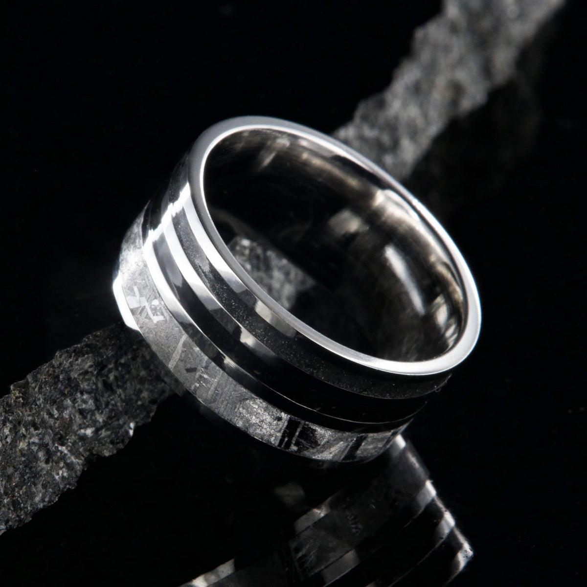 10mm wide meteorite ring with 3mm meteorite inly with 1.5mm dinosaur bone inlay, 1.5mm stardust inlay and cobalt sleeve
