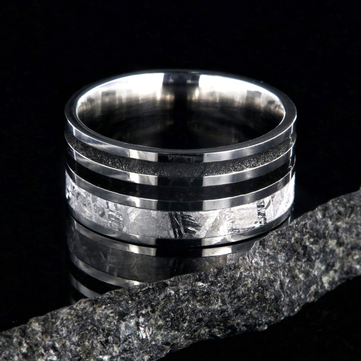 10mm wide meteorite ring with 3mm meteorite inly with 1.5mm dinosaur bone inlay, 1.5mm stardust inlay and cobalt sleeve