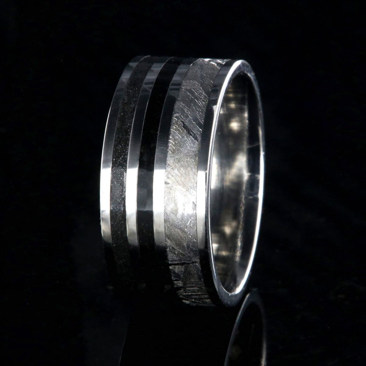 10mm wide meteorite ring with 3mm meteorite inly with 1.5mm dinosaur bone inlay, 1.5mm stardust inlay and cobalt sleeve