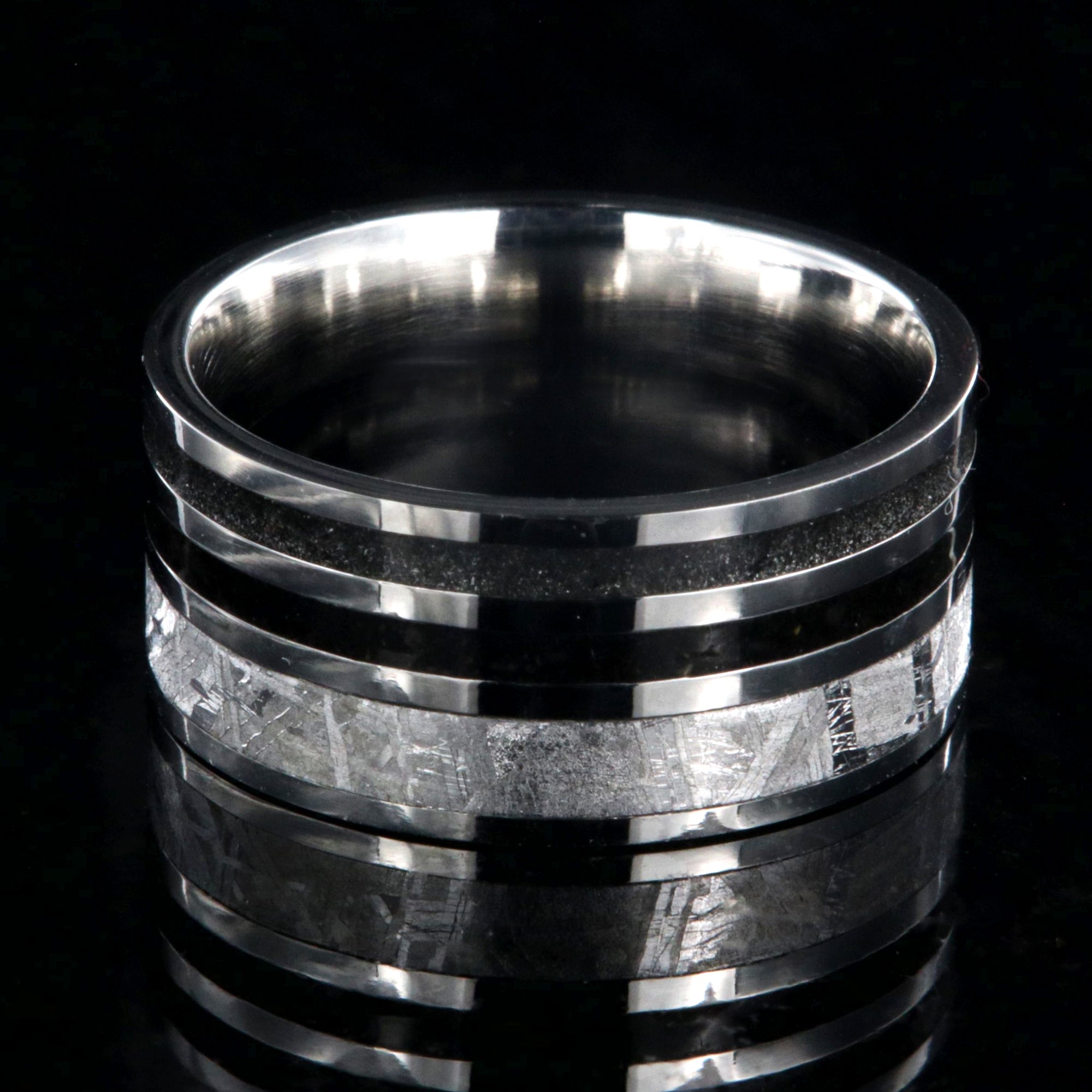 10mm wide meteorite ring with 3mm meteorite inly with 1.5mm dinosaur bone inlay, 1.5mm stardust inlay and cobalt sleeve