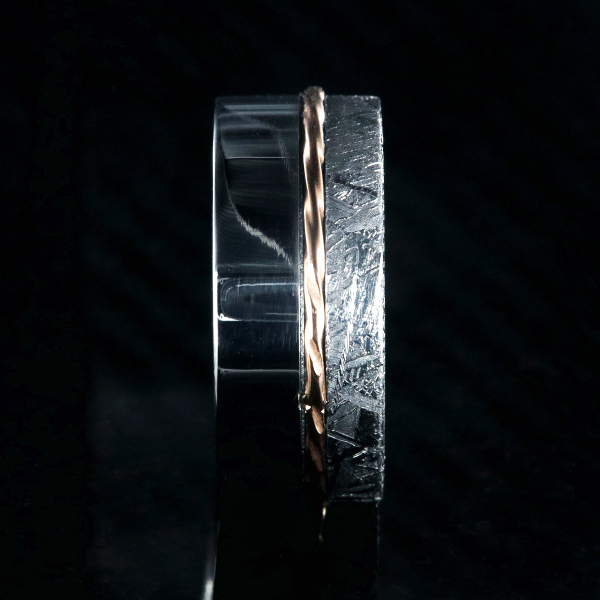 10mm wide wedding band with a wide polished cobalt edge, a centered twisted rose gold inlay, and narrow Gibeon meteorite edge