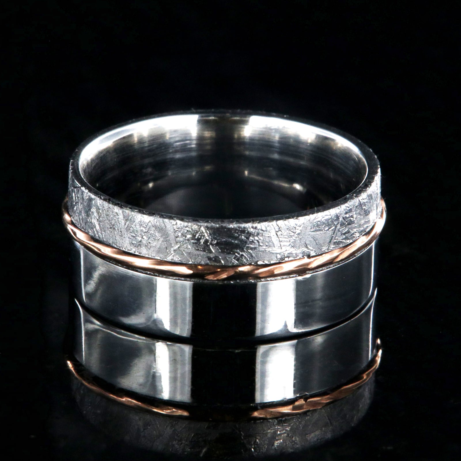10mm wide wedding band with a wide polished cobalt edge, a centered twisted rose gold inlay, and narrow Gibeon meteorite edge