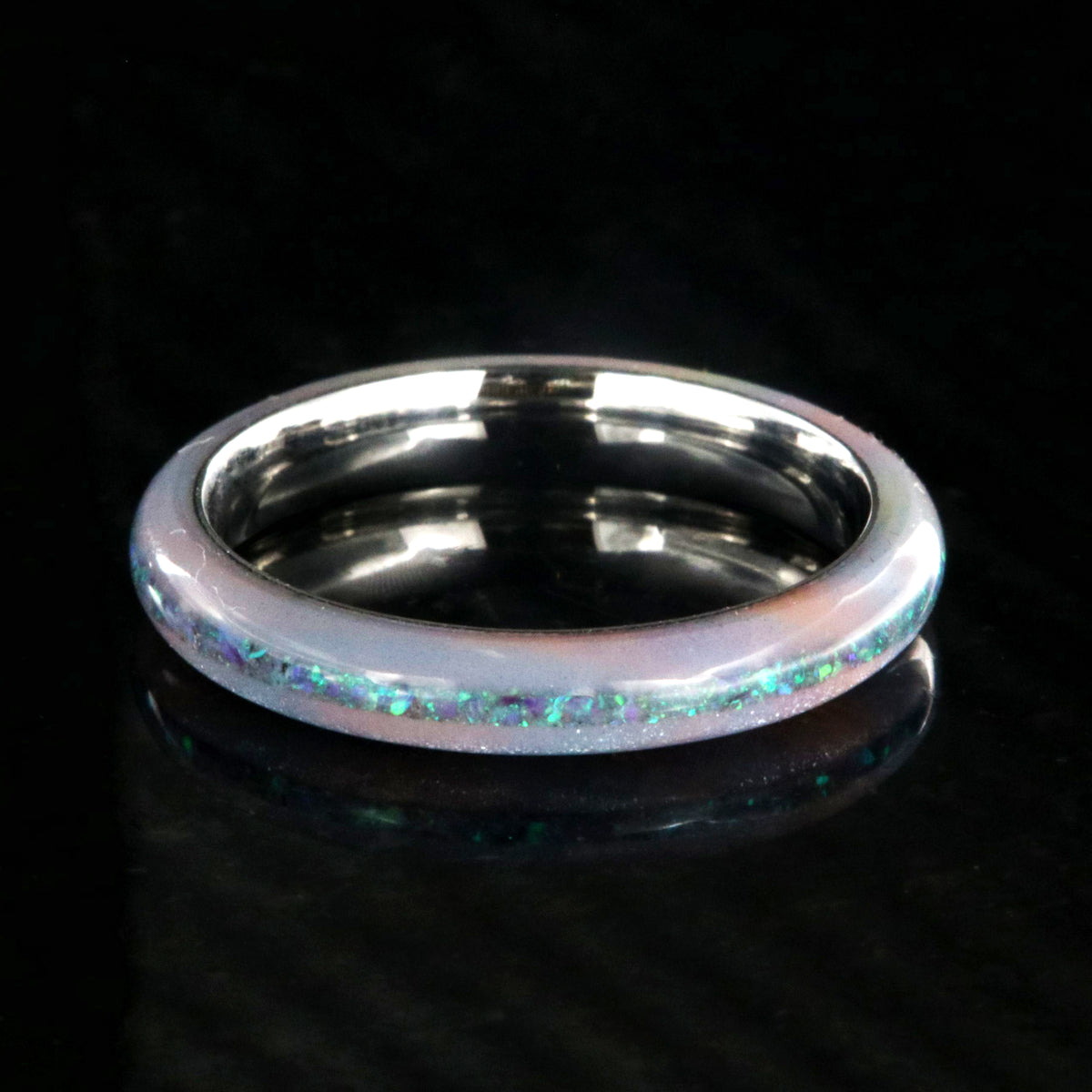 4mm wide promise ring with glittering rainbow edges and a crushed opal inlay
