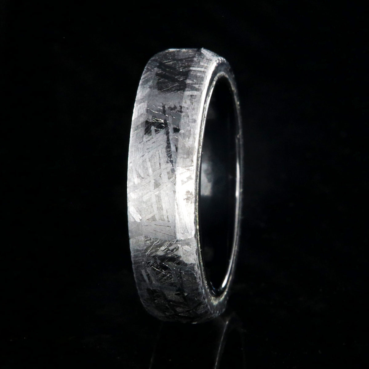 5mm wide meteorite wedding band with black titanium sleeve and beveled edges
