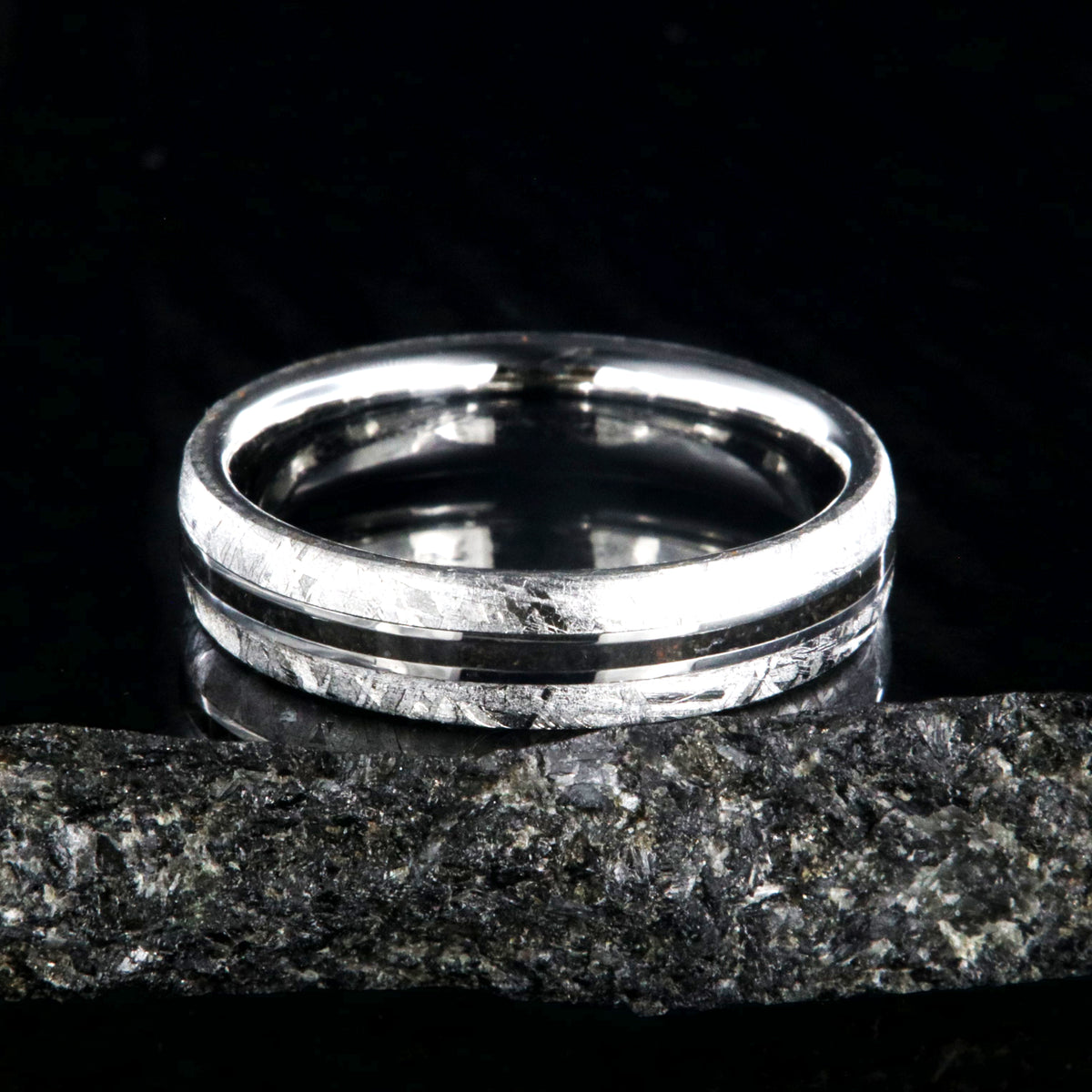 5mm wide women&#39;s wedding band with Gibeon meteorite edges and thin dinosaur bone inlay with cobalt sleeve