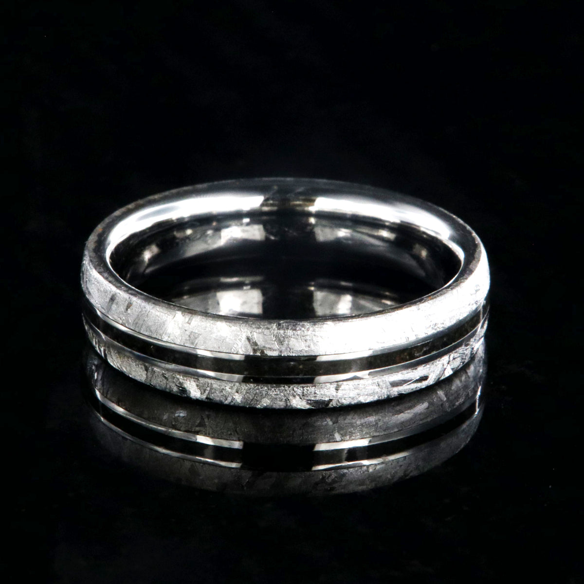 5mm wide women&#39;s wedding band with Gibeon meteorite edges and thin dinosaur bone inlay with cobalt sleeve
