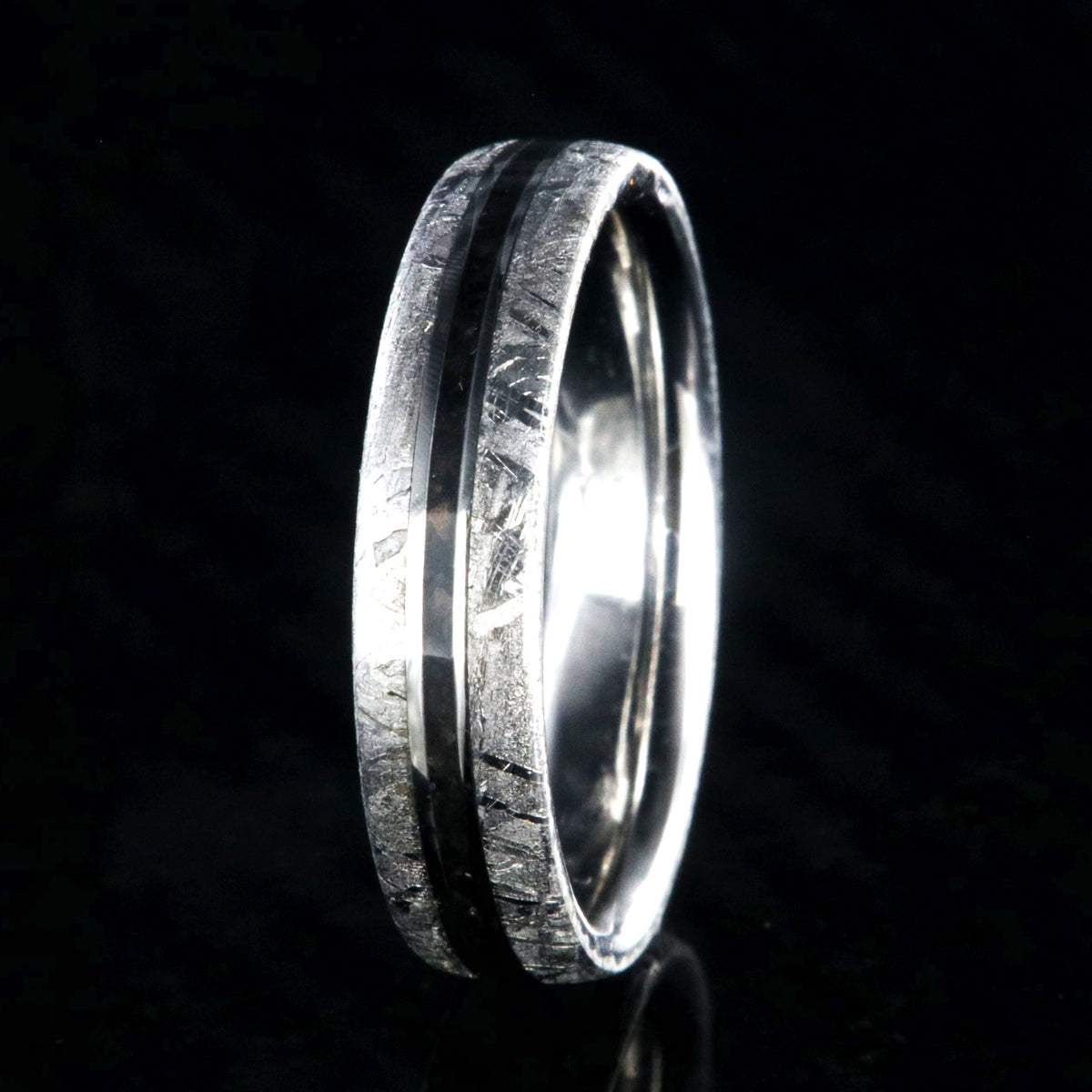 5mm wide women&#39;s wedding band with Gibeon meteorite edges and thin dinosaur bone inlay with cobalt sleeve