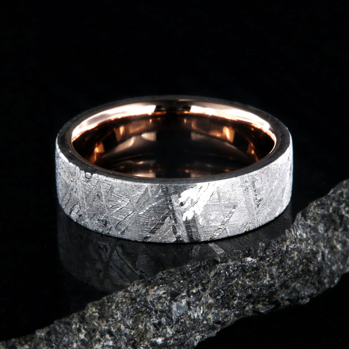 6mm wide Gibeon meteorite wedding ring with solid 14k rose gold sleeve