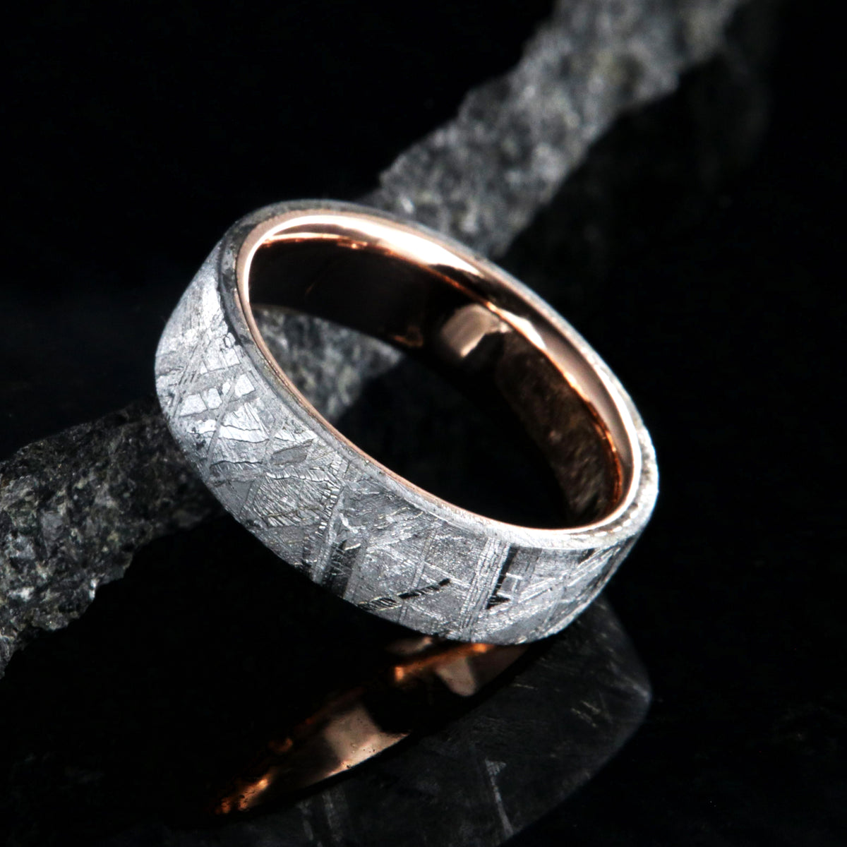 6mm wide Gibeon meteorite wedding ring with solid 14k rose gold sleeve