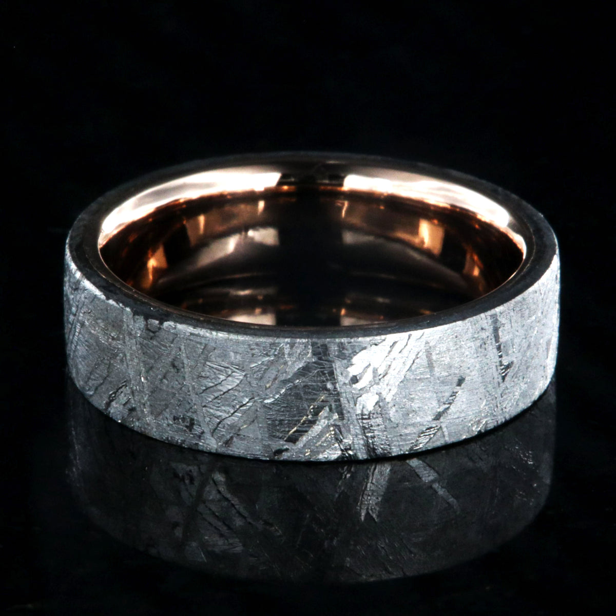 6mm wide Gibeon meteorite wedding ring with solid 14k rose gold sleeve