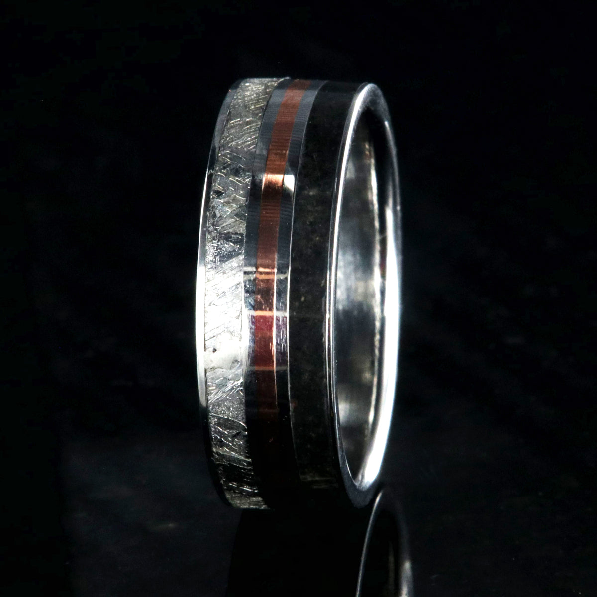 7mm wide cobalt ring with dinosaur bone fossil, copper, and Gibeone meteorite inlays