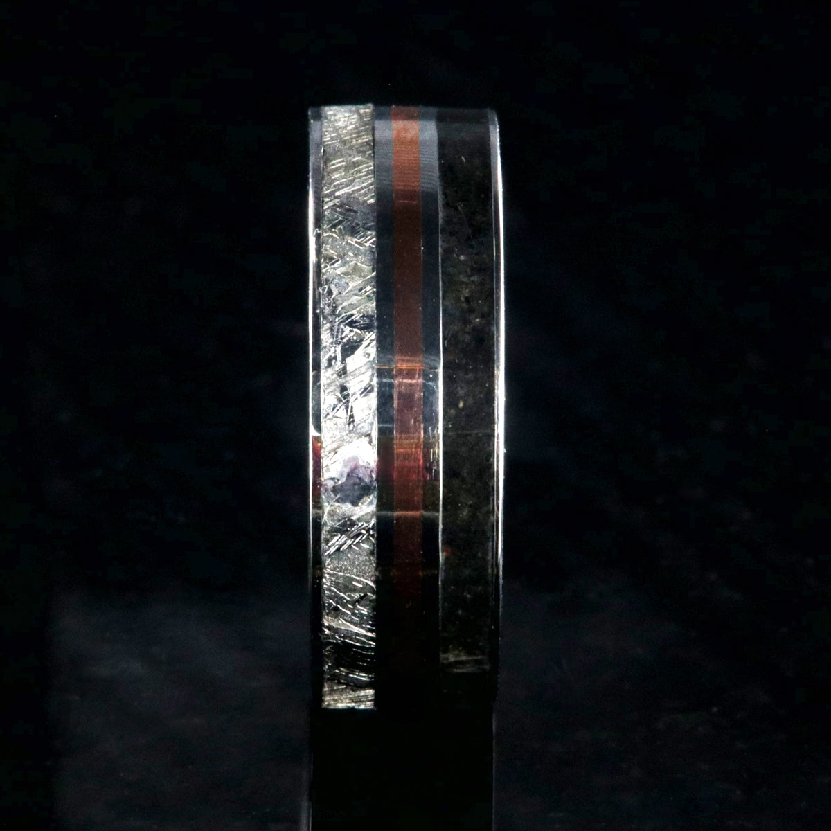 7mm wide cobalt ring with dinosaur bone fossil, copper, and Gibeone meteorite inlays