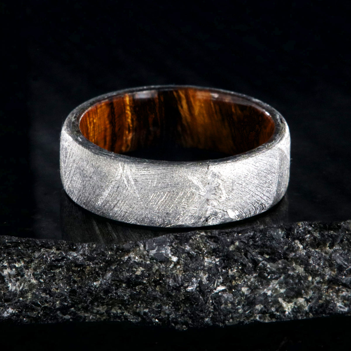 7mm wide men&#39;s wedding band with Gibeon meteorite outside and smooth Arizona ironwood sleeve
