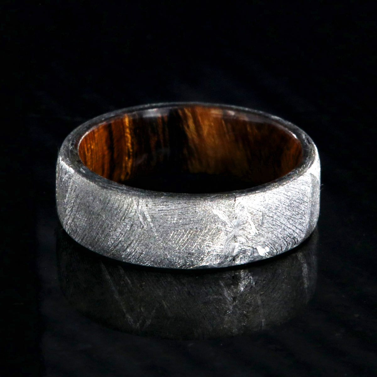 7mm wide men&#39;s wedding band with Gibeon meteorite outside and smooth Arizona ironwood sleeve