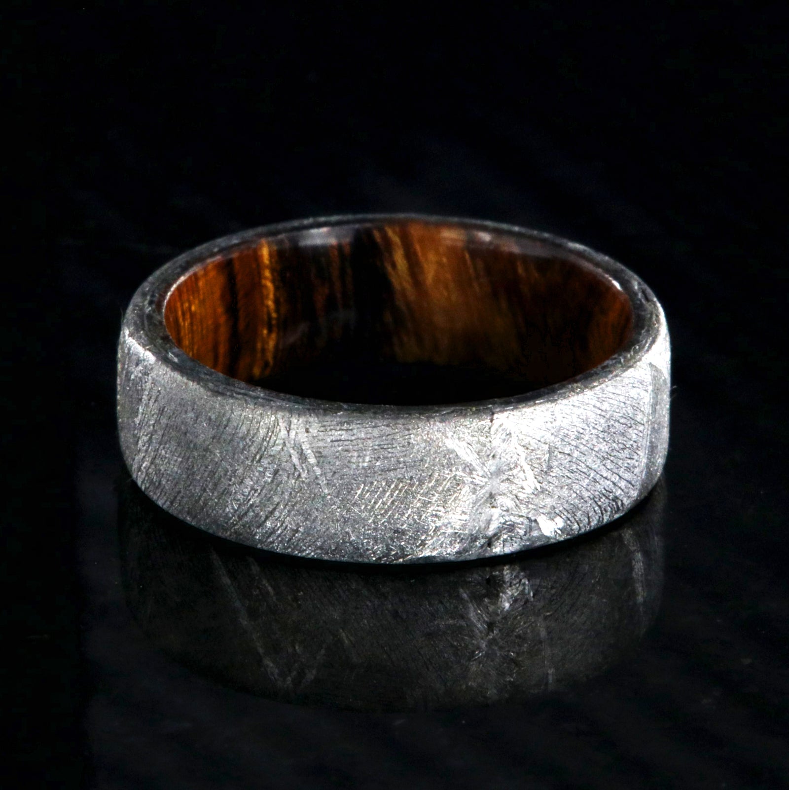 7mm wide men's wedding band with Gibeon meteorite outside and smooth Arizona ironwood sleeve