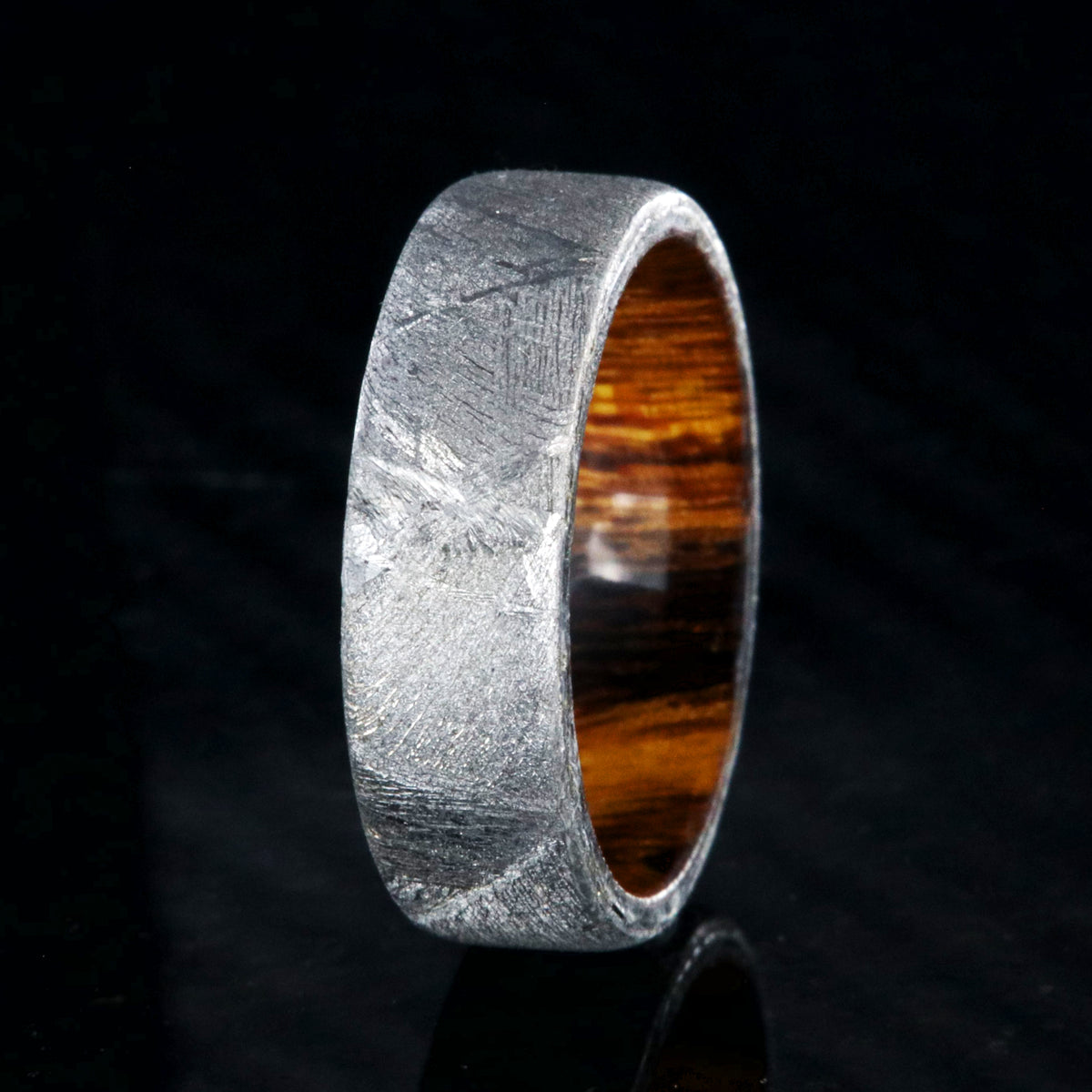 7mm wide men&#39;s wedding band with Gibeon meteorite outside and smooth Arizona ironwood sleeve