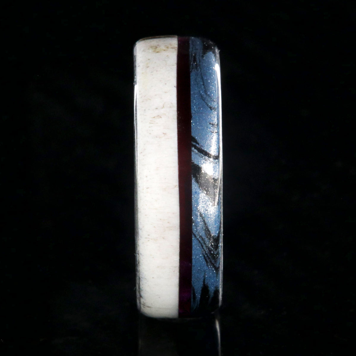 7mm wide wedding band with half antler, half cobaltium mokume, and a maroon pinstripe inlay