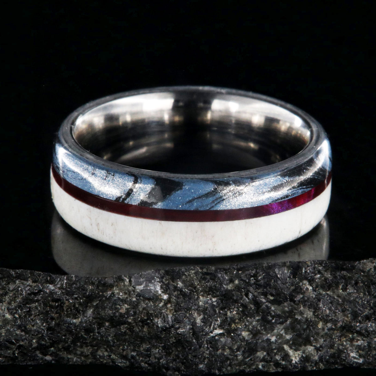7mm wide wedding band with half antler, half cobaltium mokume, and a maroon pinstripe inlay