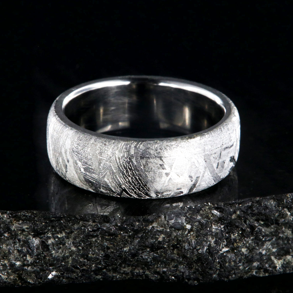7mm wide Gibeon meteorite wedding band with a cobalt sleeve and rounded profile