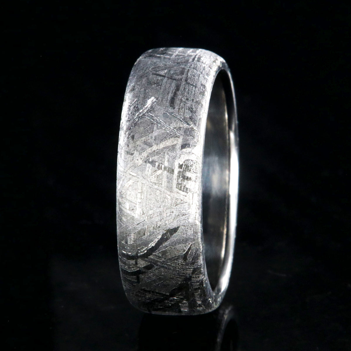 7mm wide Gibeon meteorite wedding band with a cobalt sleeve and rounded profile